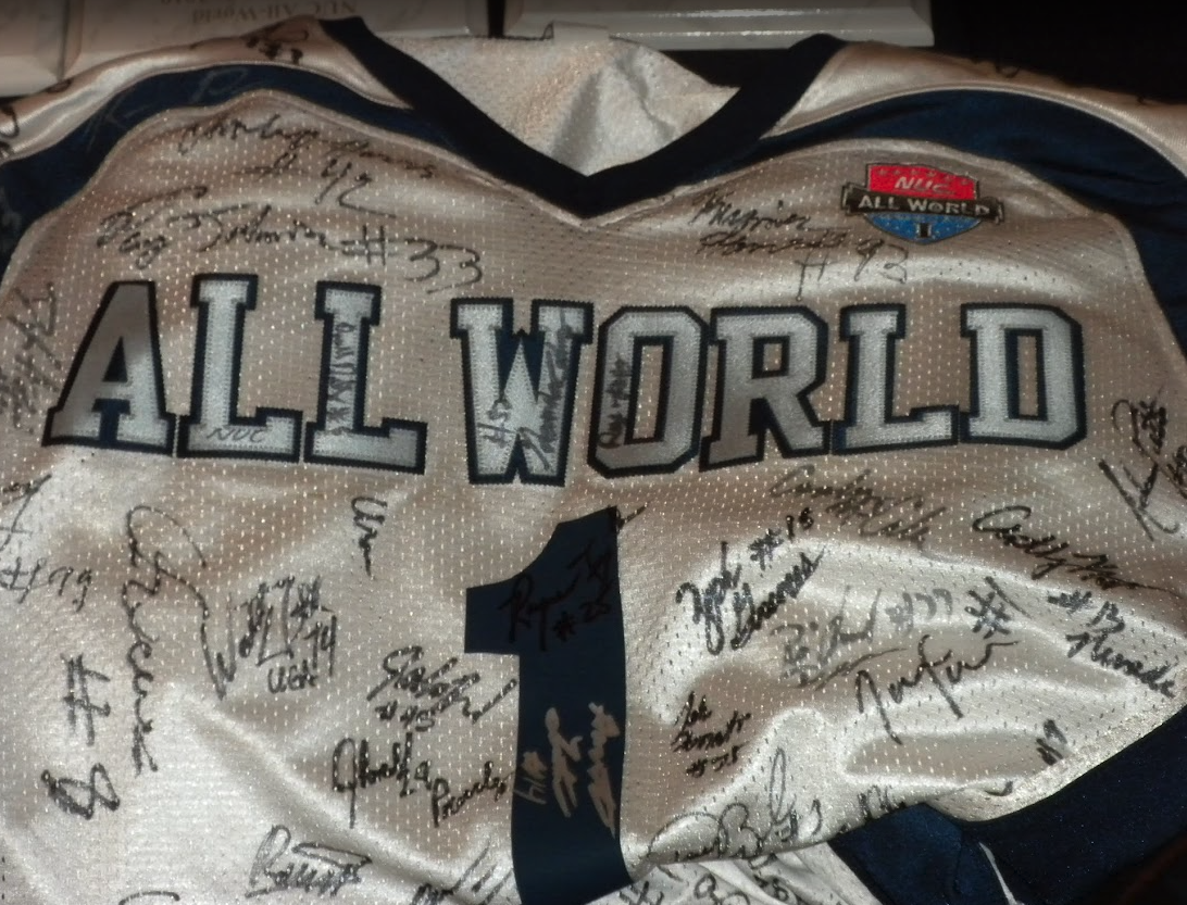 Signed NUC All World game jersey covered in player autographs