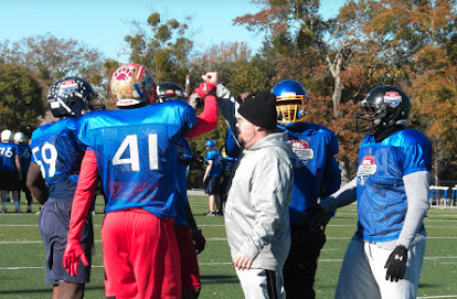 NUC All World players celebrating with a high five during practice