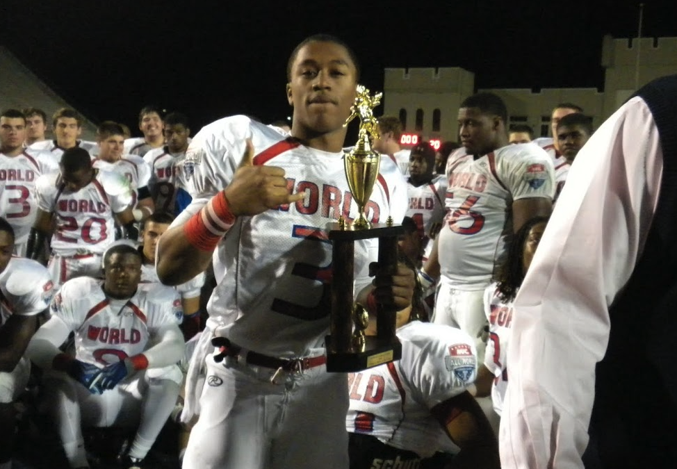 All World player holding a trophy in front of teammates after the game