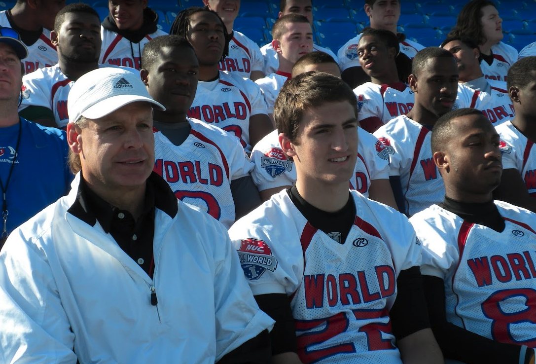 Coach and Team World players seated together for the team photo