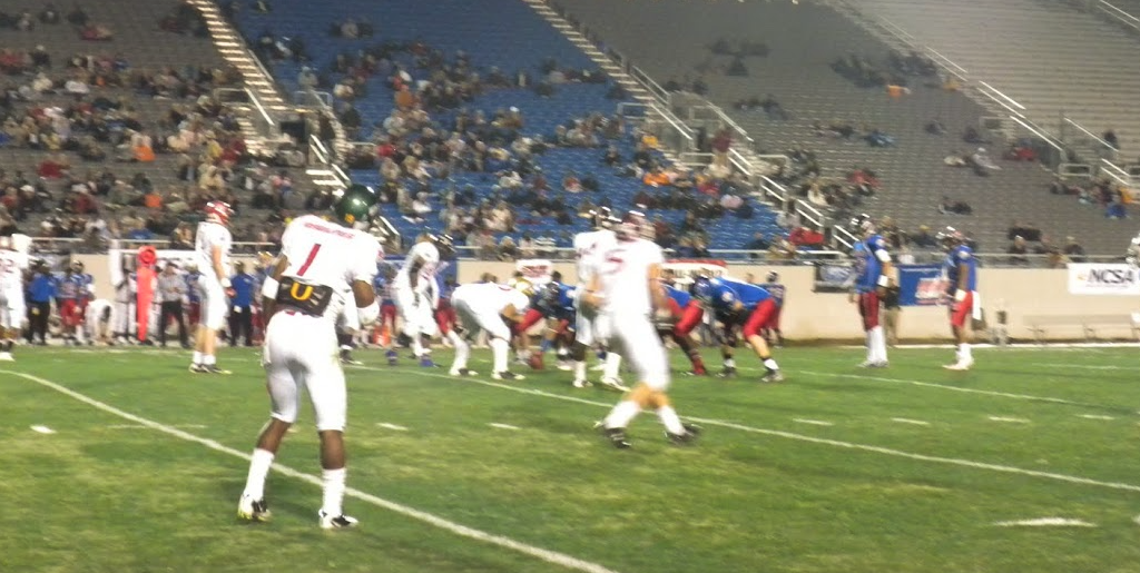 Wide stadium shot of the All American Game lined up before the snap