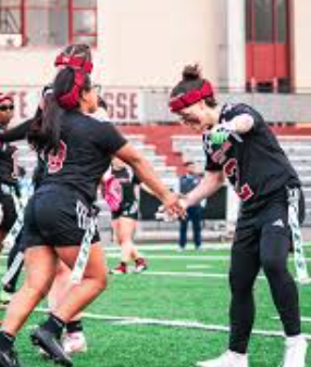 Montclair State teammates celebrating on the field