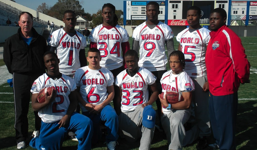 Team World position group photo on the field with coaches in jerseys